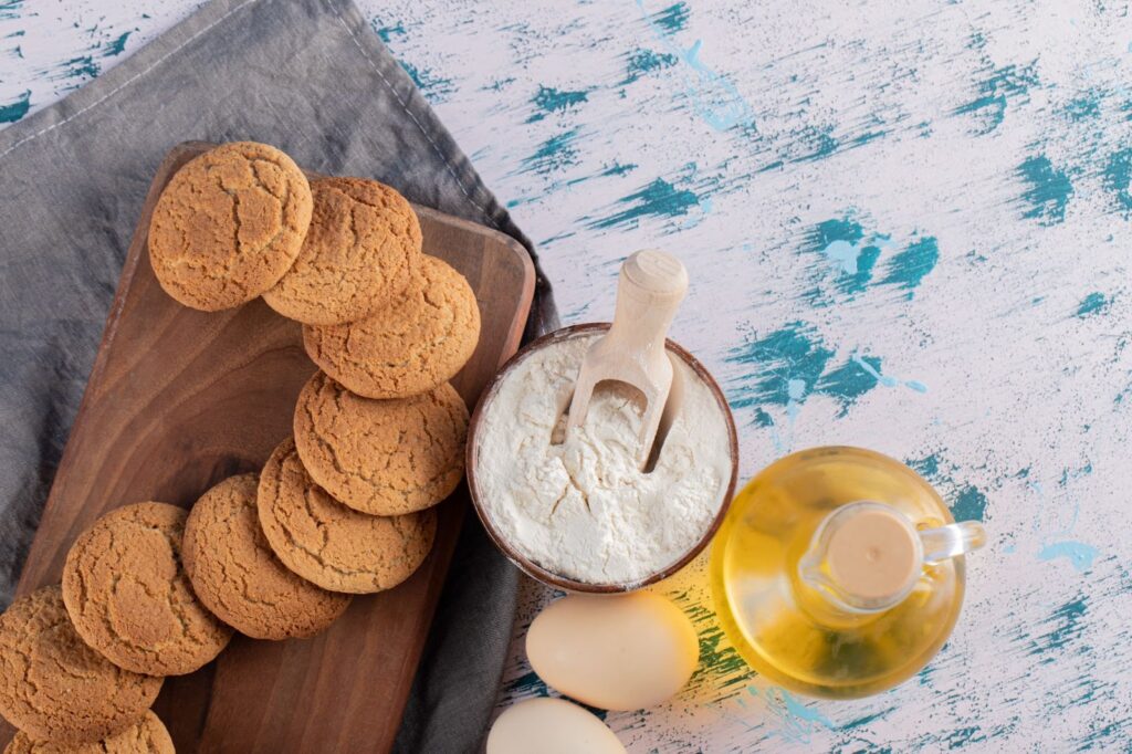 Сookies in a wooden platter with ingredients around